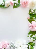Pink floral. assorted pink flowers border on white photo
