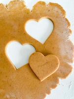 The process of cooking heart cookies. Top view raw photo