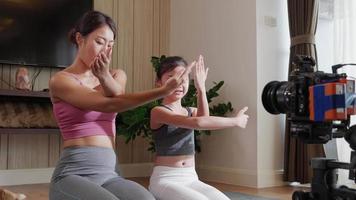 Asian Yoga Instructor and Daughter Create Online Classes for Healthy Living, Fitness on Social Media video