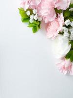 Pink floral. assorted pink flowers border on white photo