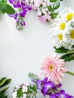 dianthus, gerbera, chamomile, laurel. floral frame