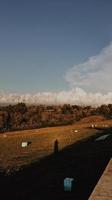 Beautiful cloudy potrait nature view in the morning with human shadow photo