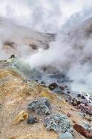 Mountain landscape, crater of active volcano fumarole, hot spring, lava field, gas-steam activity. Dramatic volcanic landscape, travel destinations photo