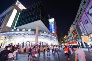 SHENZHEN, CHINA-APR 08, 2017-Shoppers and visitors crowd the famous Dongmen Pedestrian Street. Dongmen is a shopping area and subdistrict within Luohu District of Shenzhen on April 08, 2017. photo