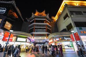 SHENZHEN, CHINA-APR 08, 2017-Shoppers and visitors crowd the famous Dongmen Pedestrian Street. Dongmen is a shopping area and subdistrict within Luohu District of Shenzhen on April 08, 2017. photo