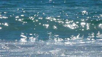 Waves rolled on the sand of Mai Khao Beach, Phuket, Thailand. Slow motion video