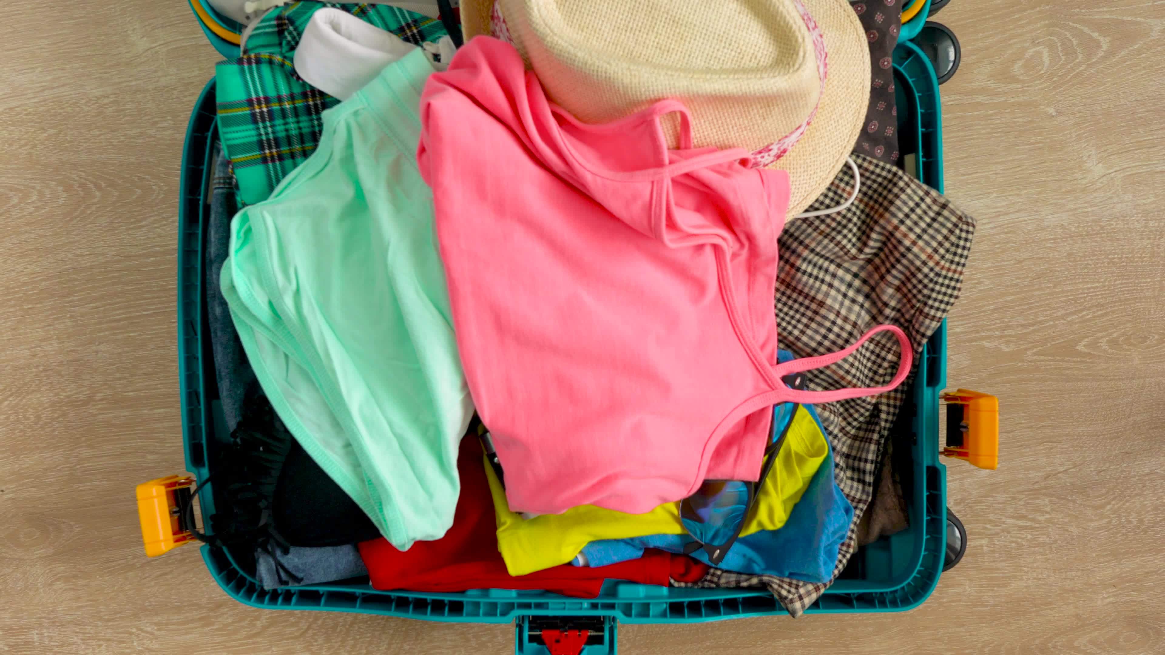 Things are falling into a suitcase, and the suitcase is closed