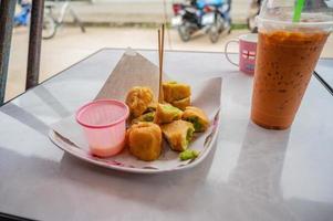 Close up Famous stuffed chinese donut with thai pandan custard stall at chiangkhan loei city Thailand.Chiang Khan is an old town and a very popular destination for Thai tourists photo