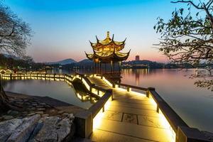 beautiful hangzhou in sunset and ancient pavilion photo
