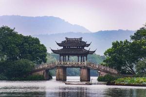 a very famous pavilion bridge-yu dai qiao - in west lake, hangzhou, china was built in song dynasty and rebuilt in qing dynasty photo