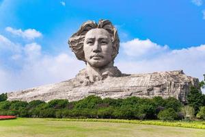 CHANGSHA, CHINA - OCT 29, 2017-Youth Mao Zedong Statue is located in Orange Isle, Changsha, Hunan, China. The monument stands 32 metres tall. photo