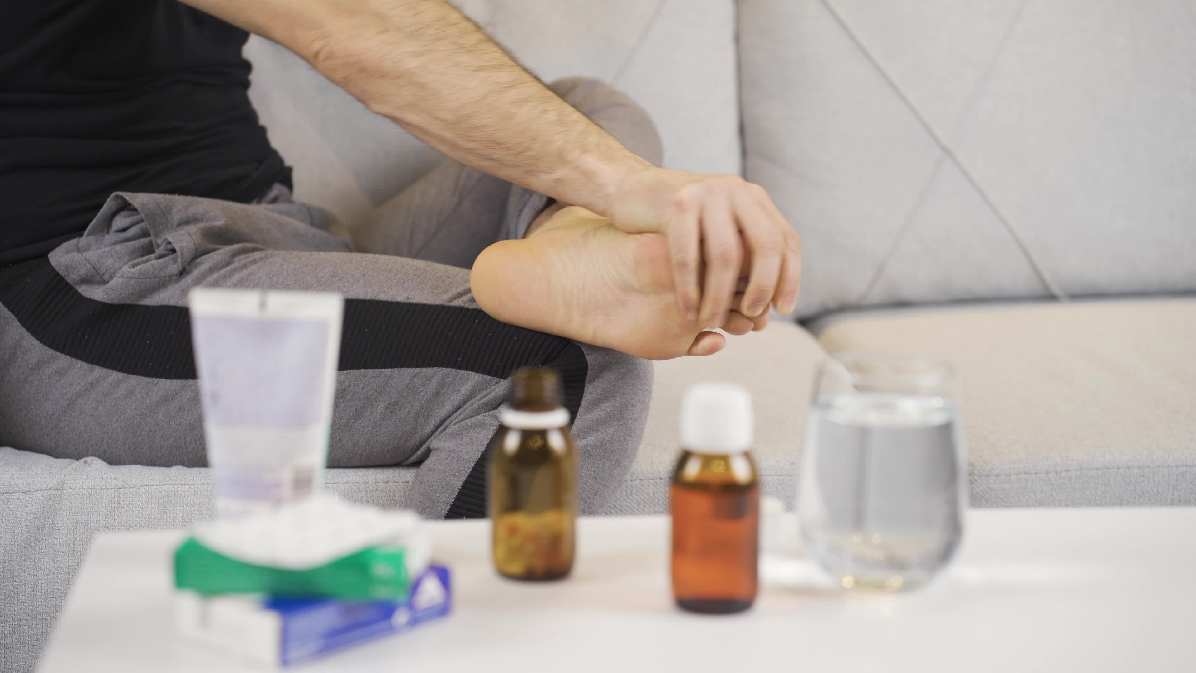 Redness, itching, burning, etc. Closeup of male foot with disease