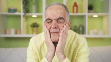 Close-up portrait of tense and stressed old man. Sad middle-aged man is nervous, his eyes are full of tears, he feels unhappy and sad. video