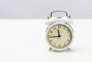 Round white alarm clock photo