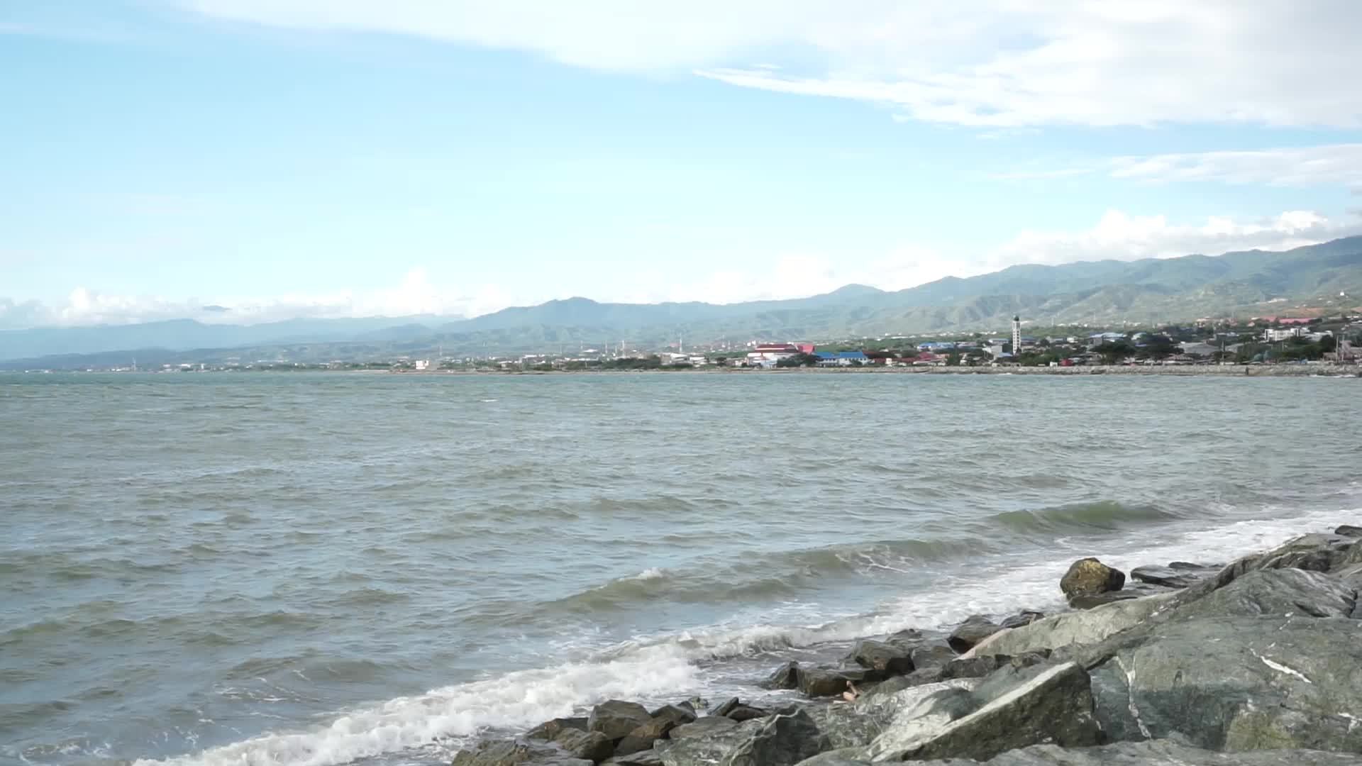 Sea wave hits the stony shore. The surf hits the Stones on the shore