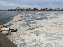 Foaming sea water on the outfall coal fired power plant. The photo is suitable to use for waste water poster, power plant activity and environment content media.