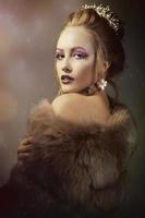 Luxurious girl with a beautiful make-up in a fur coat. Beauty in furs. Model on a bokeh background. Young beautiful woman. photo