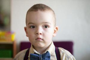 A beautiful five year old child. The boy is a preschooler. photo