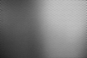 White Punched Metal Sheet Wall Texture Background. photo