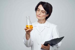 woman laboratory assistant science chemical solution research technology photo