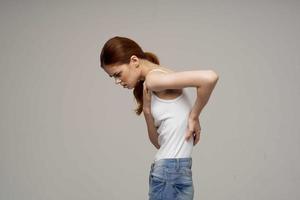 woman back pain health problems osteoporosis isolated background photo