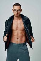 handsome man wearing glasses short hair leather jacket posing fashion photo