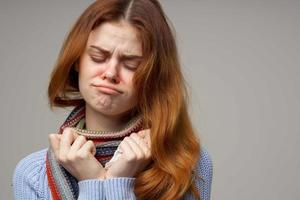 red-haired woman health problems temperature isolated background photo