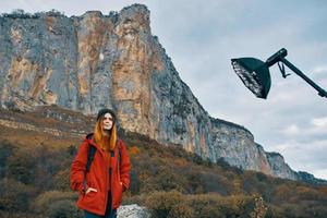 Hiker woman by the mountains photo