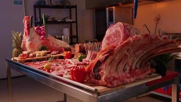 Meat products layout lamb loins and steak pork cuts and vegetables. video