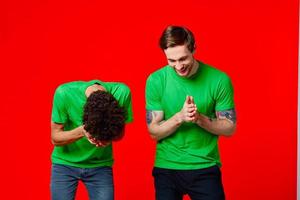 Cheerful friends laugh communication emotions red background photo