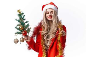 cheerful woman decoration Christmas tree holiday light background photo