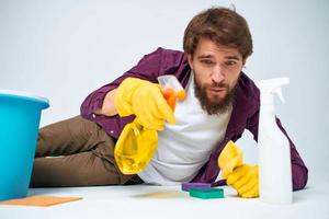 Bearded man detergent cleaning work Professional homework photo