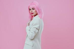 Pretty young female in a suit makeup pink hair posing color background unaltered photo