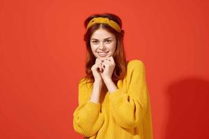 cheerful woman in yellow sweater hipster clothes studio fashion lifestyle photo