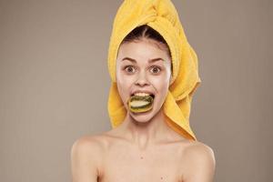 cheerful woman with bare shoulders towel on her head clean skin health kiwi freshness photo