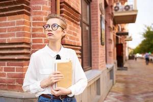 pretty woman with a book in his hands outdoors reading Lifestyle photo