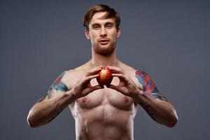 athletic young man with muscular muscles and abs naked torso apple health photo