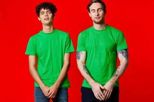two men in green t-shirts three squads emotions fun photo