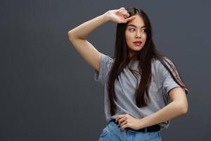 portrait woman in a t-shirt and jeans posing Youth style isolated background photo