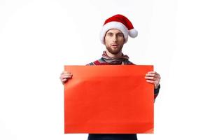 Cheerful man in a christmas hat with Red mockup poster copy-space studio photo