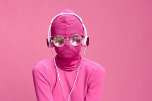 Creative crazy pink photo on a pink background with pink clothes and accessories, cyberpunk concept and conceptual art photography
