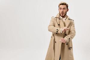 man in coat small fish studio lifestyle isolated background photo