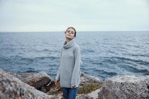 beautiful woman beach tourism cloudy weather stone coast unaltered photo