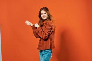 woman in red sweater decoration studio red background photo