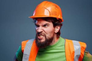 emotional man worker orange paint hard work photo