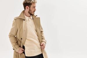 handsome man beige coat fashion modern style photo