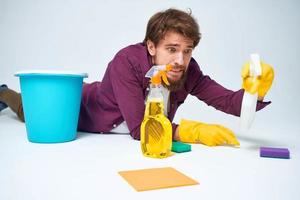 man with a bucket on the floor detergent service lifestyle photo