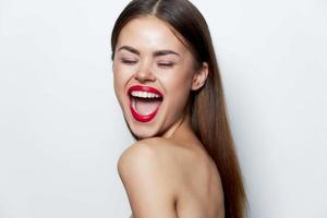 Woman portrait Naked shoulders wide open mouth closed eyes studio red lips photo