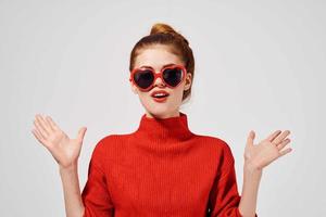 beautiful woman in a red sweater isolated background photo