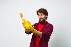 man with detergent in rubber gloves hands service professional photo